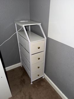 Tall skinny dresser with charging port.