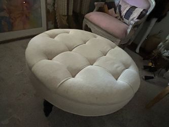 Beige round ottoman