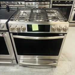 GE Natural Gas Range (Stainless Steel) — Includes receipt for a 90-day warranty.