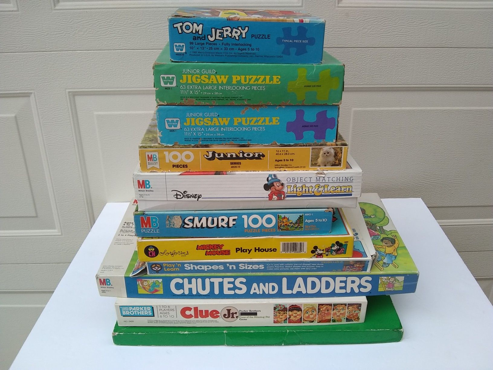 collection of children's board games and puzzles