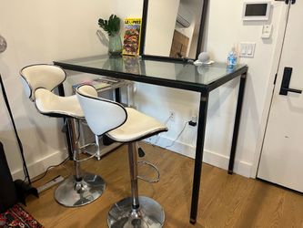 Glass tabletop table with metal frame