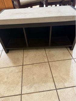 Bench with three storage compartments