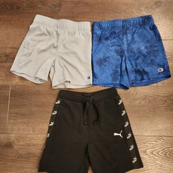 3 Boy shorts - two pairs of Champion and a black pair of PUMA Tape Shorts. good condition 