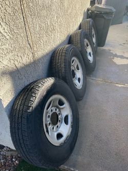 Four LT245/75R16 tires with wheels