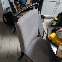 gray upholstered Parsons-style chair