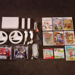 NINTENDO WII With 9 Games And 2 Controllers + 2 Wheels