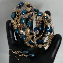 elegant gold plated spiral bracelet and earring set