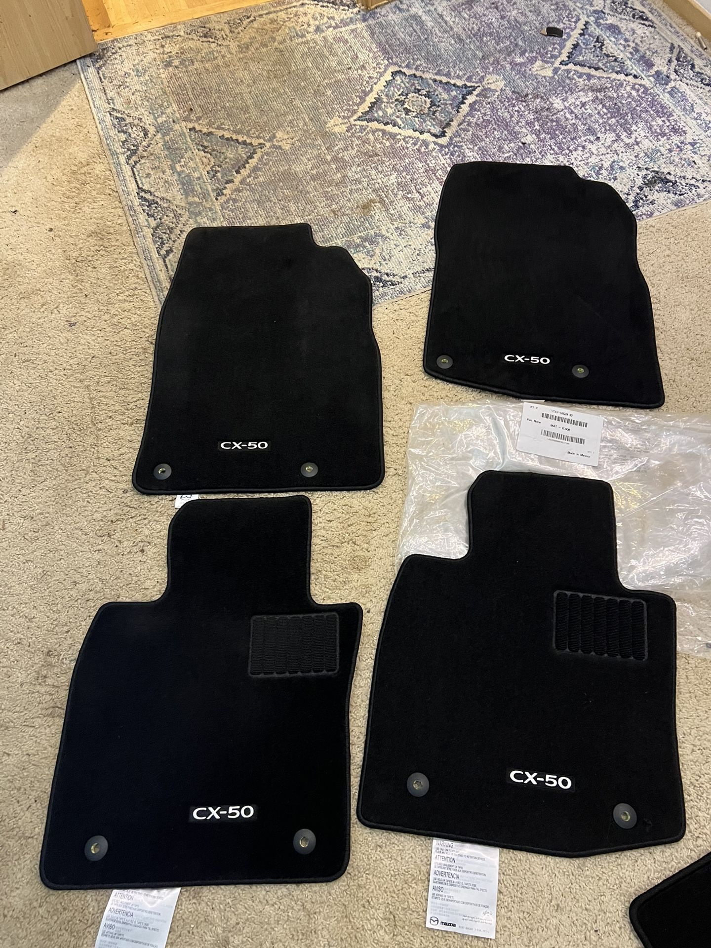 NEW Mazda CX-50 Floor & Cargo Mat Set β Genuine OEM  Brand new Mazda CX-50 floor and cargo mat set.