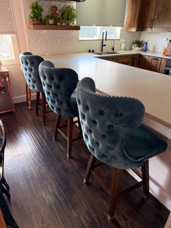 Three Counter Height Chairs