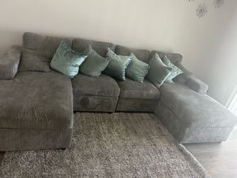 Fairly new couch and pillows