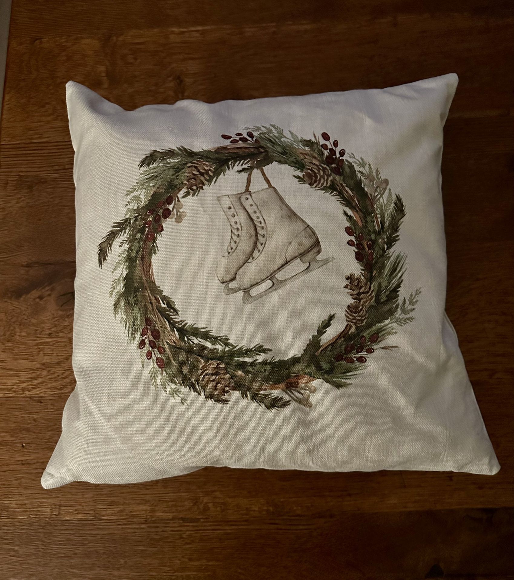 Decorative pillow with wreath and ice skate 
