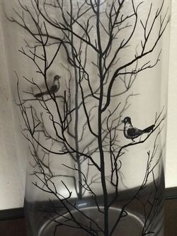 Clear vase with original tree with birds picture
