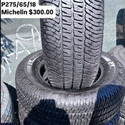 SET OF FOUR USED TIRES ALMOST NEW 275/65/18 ,MICHELIN A/T 
