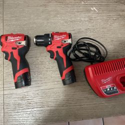 Milwaukee M12 brushless impact driver and drill driver with two batteries and charger