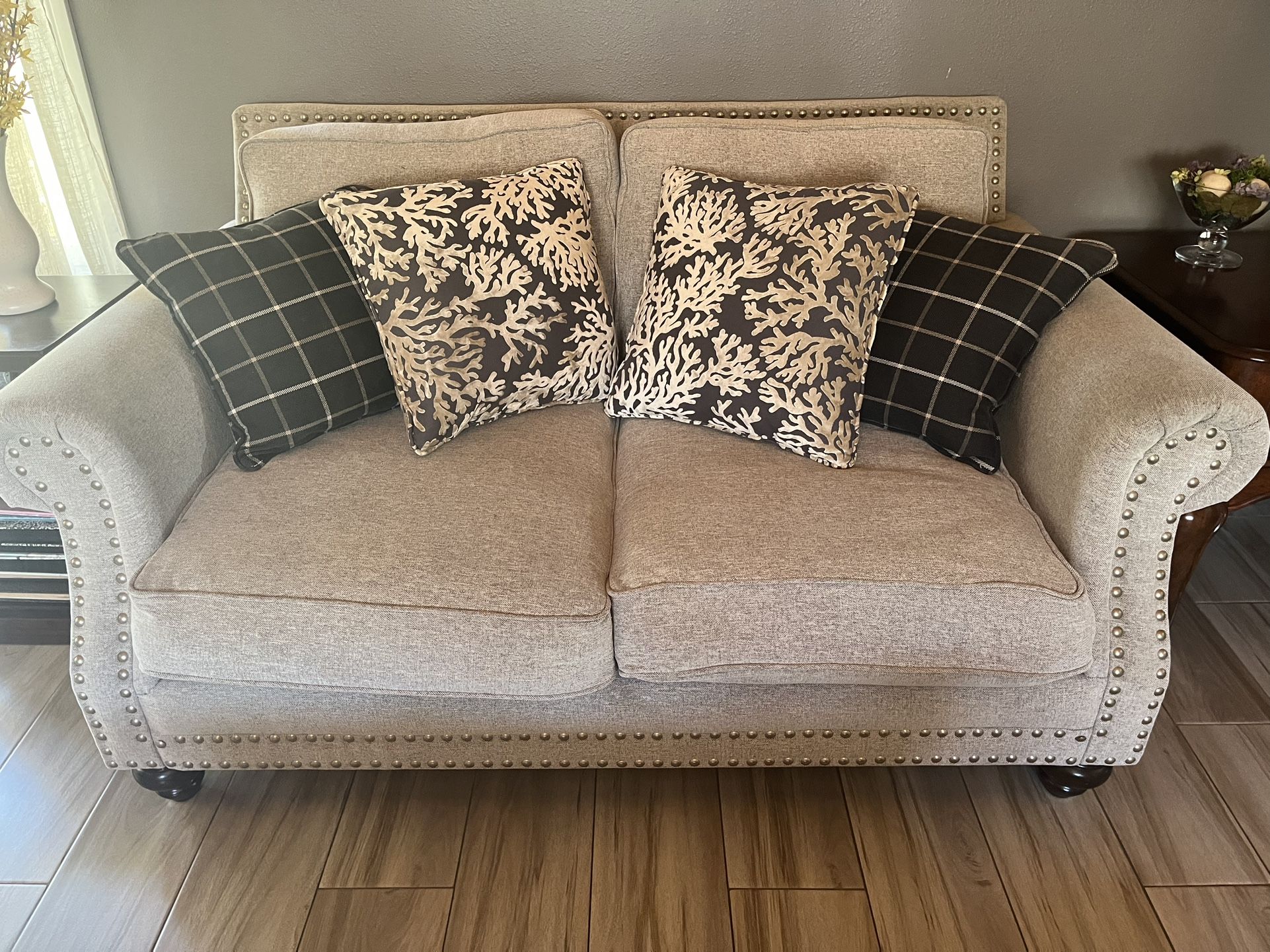 Tan Couches With Blue Pillows