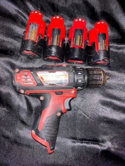 12v Milwaukee drill with 4 batteries