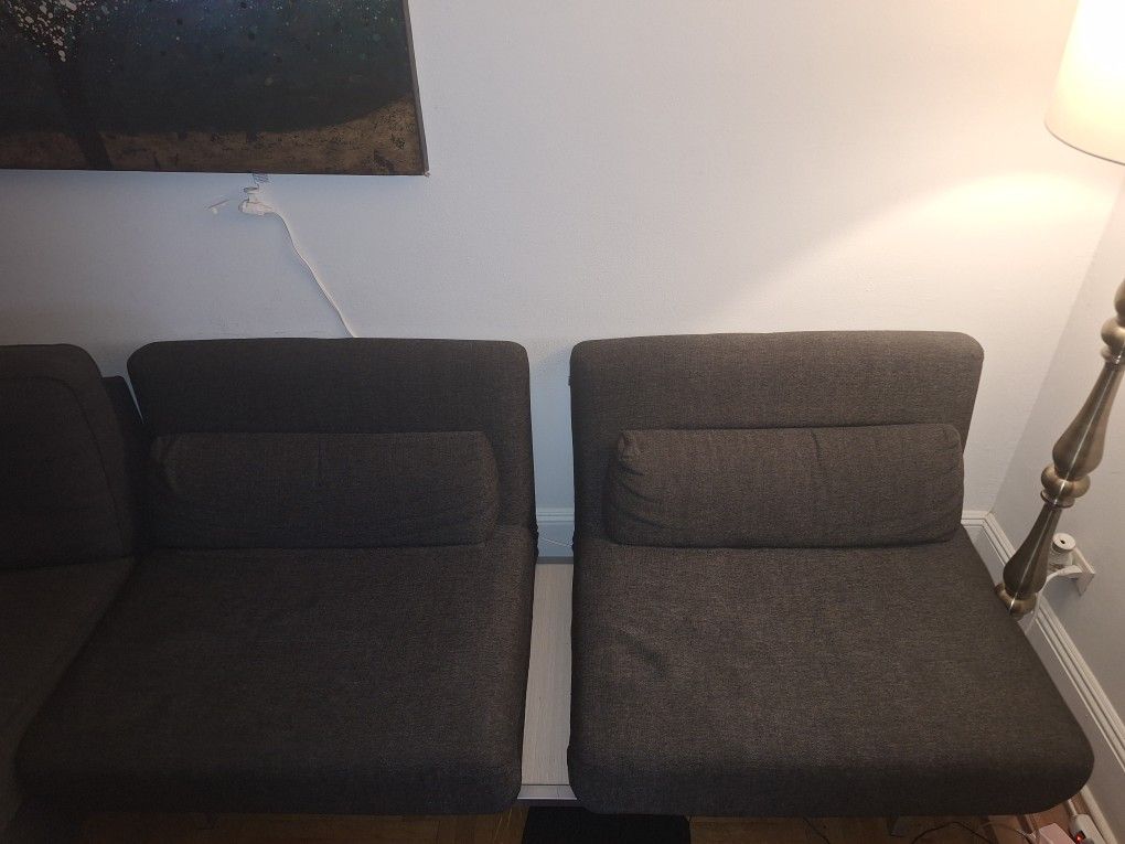 Two Seat Grey Pull-Out Couch With Middle Table