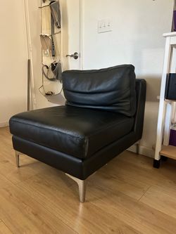 Black leather love seat