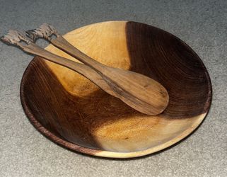 Wooden salad bowl and tongs