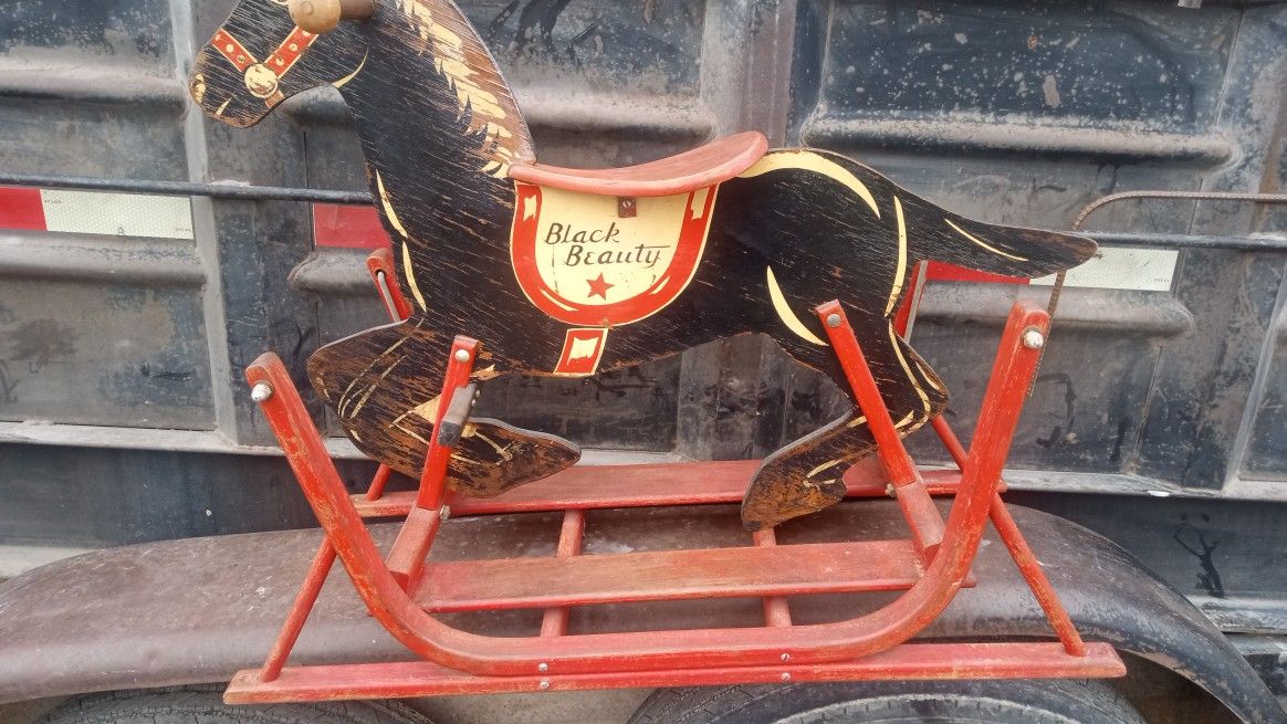 I'm selling an antique wooden rocking horse. For collectors, make an offer.