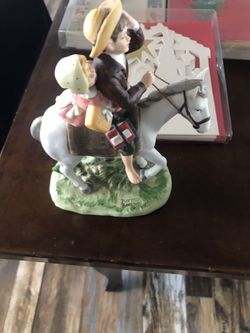 Porcelain figurine Children riding a horse