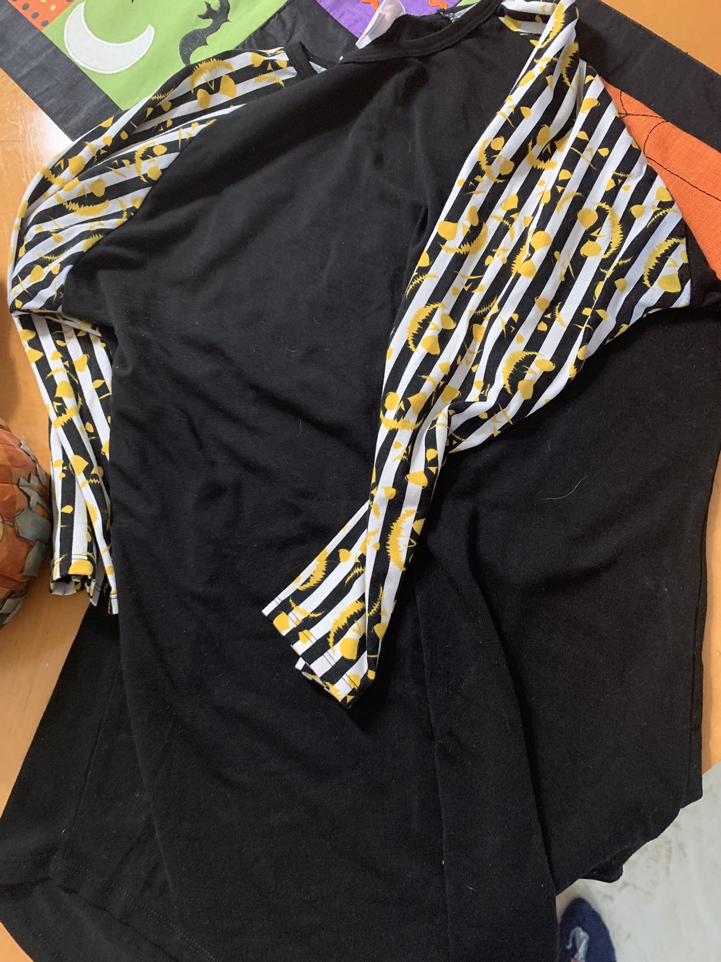 Lularoe Randy top size 10 kids Black Shirt with Halloween  Patterned Sleeves