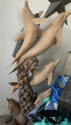 Wood dolphin statue
