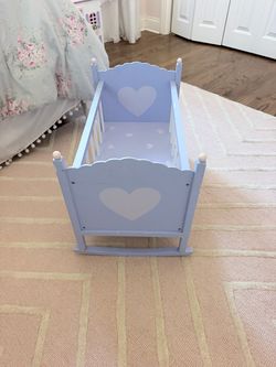 Purple wooden baby doll cradle with pink hearts