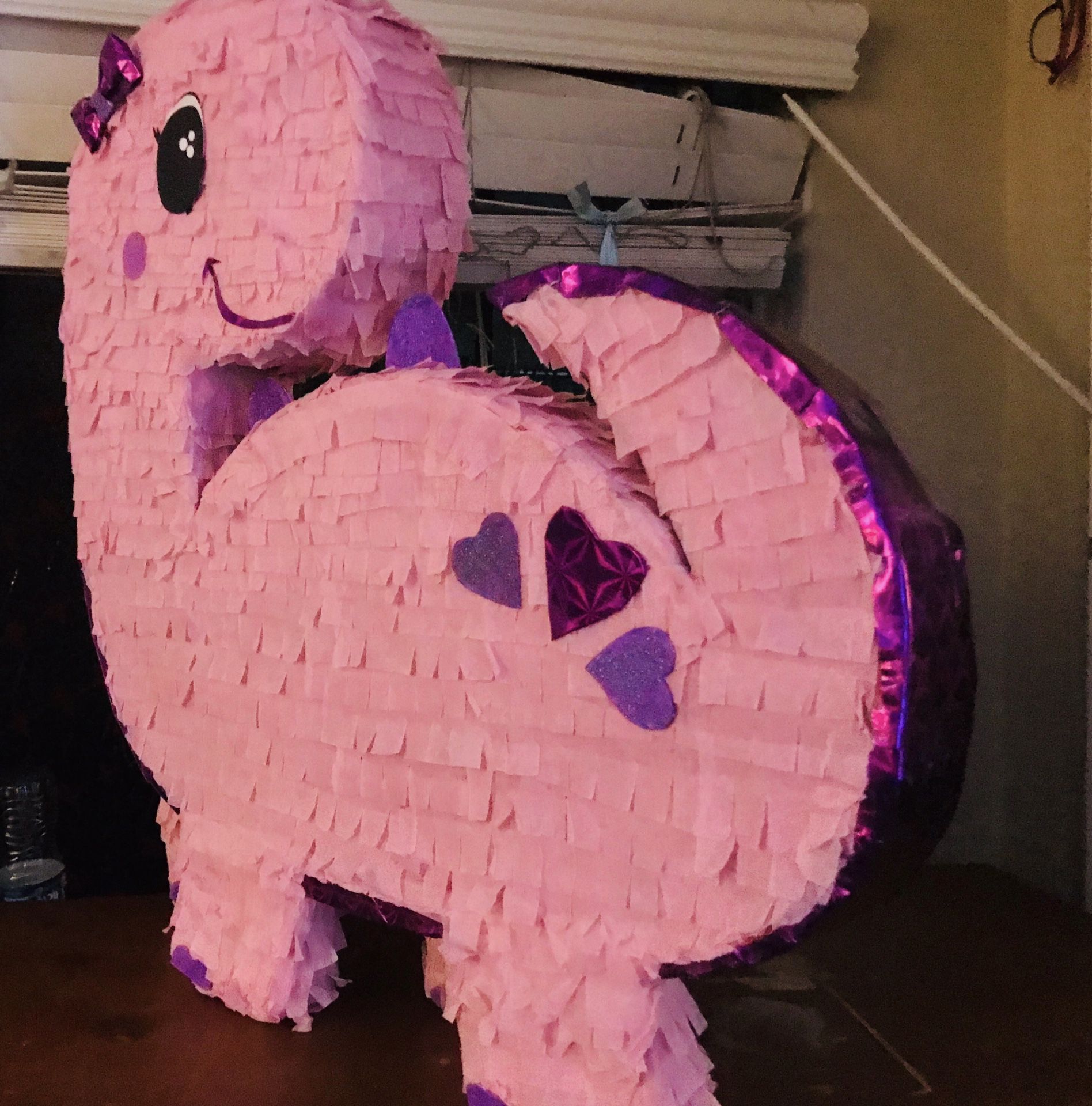 dinosaur party piñata pink and purple