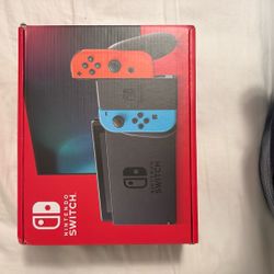 BRAND NEW!! Nintendo Switch w/ Neon Blue & Neon Red Joy-Con