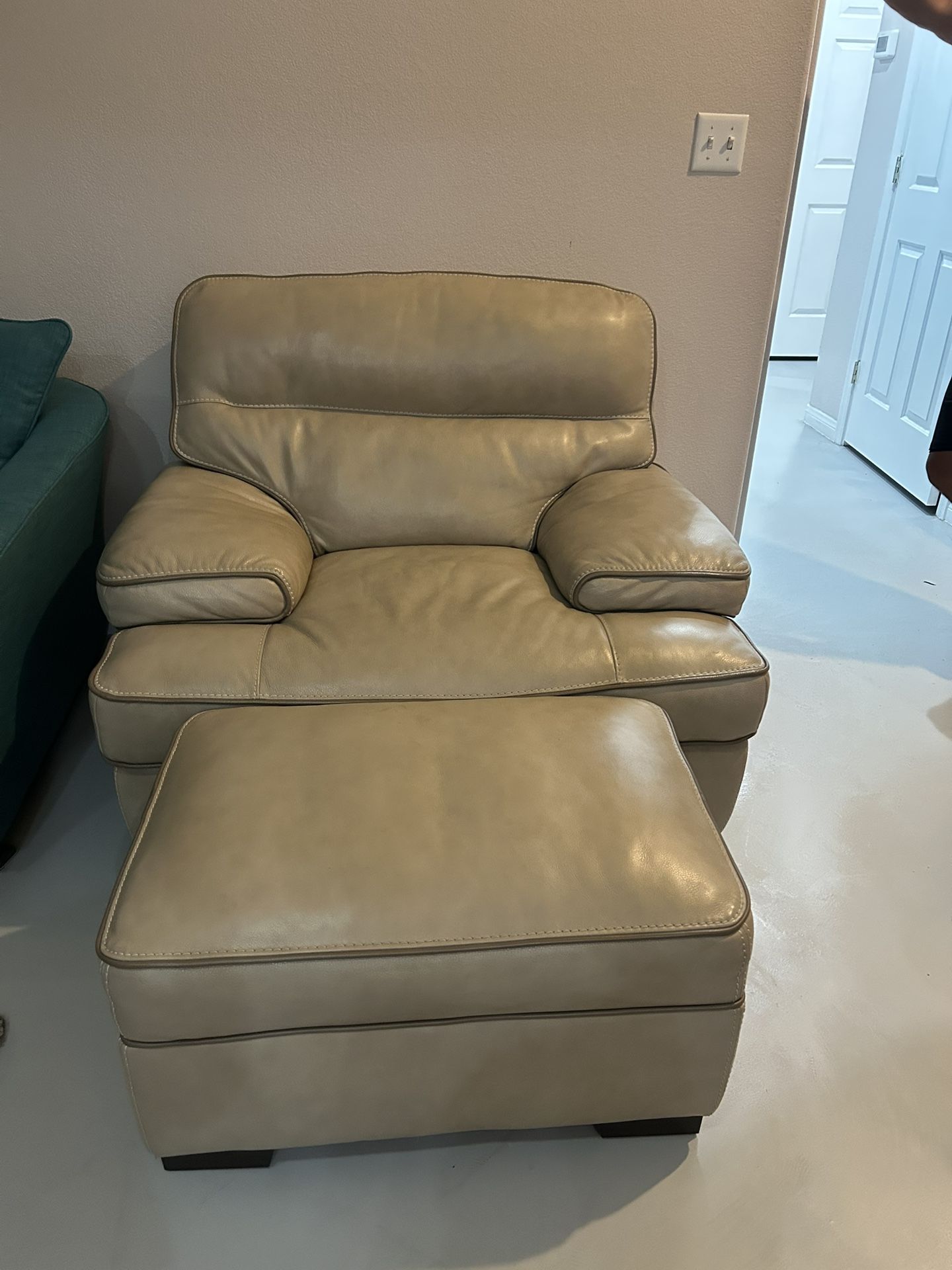 Real leather chair and ottoman. 