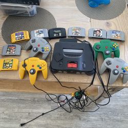 Complete original Nintendo 64 set N64 with all four controllers, expansion pack, and 8 video games  Pick up only located in Orting 