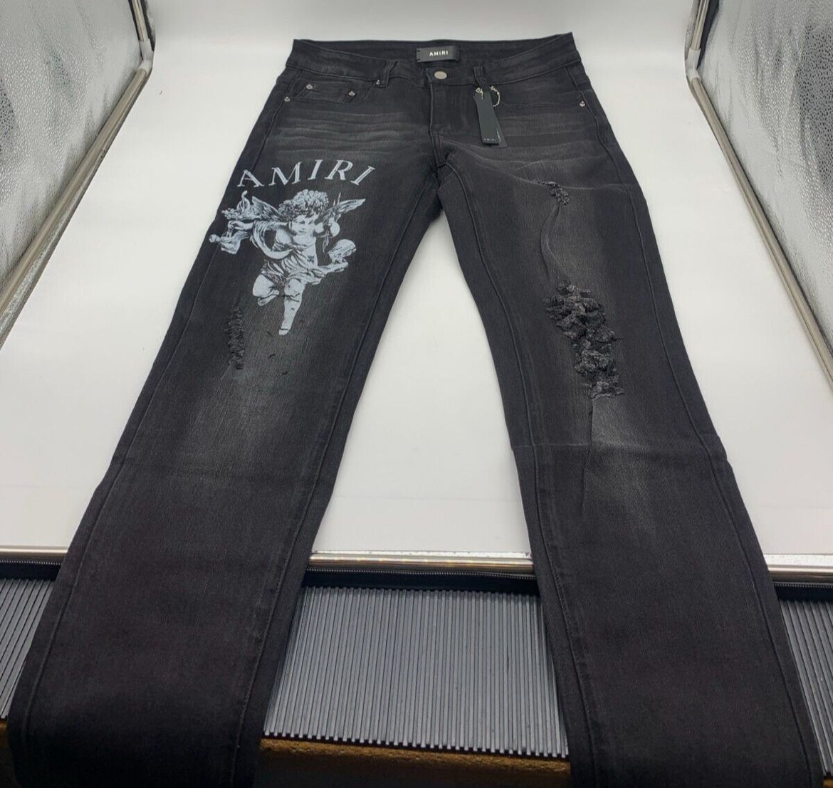 AMIRI Black Distressed Jeans with Angel Graphic – Men’s Designer Denim