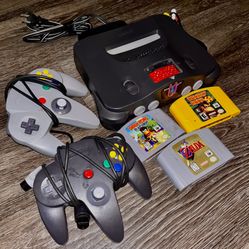 Nintendo 64 W/ Controllers, Games, And Cords