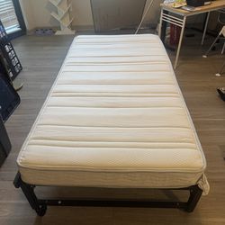 Twin bed with foldable base