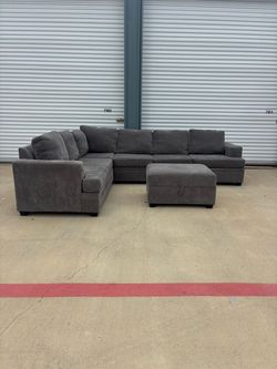 Beautiful grey living spaces with storage ottoman