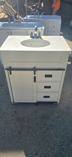 Bathroom vanity with sink and faucet