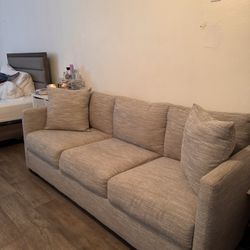 Grey Couch With 2 Pillows