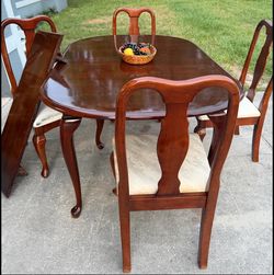 Wood table with four chairs and leaf