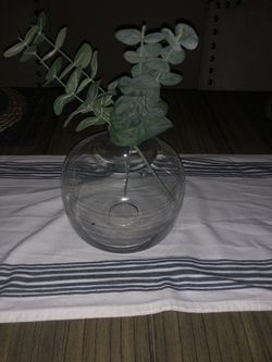 Fake plant with glass vase