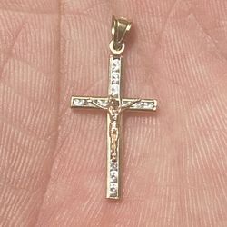10-carat gold cross with very beautiful stones, new Jesus is rose gold, the size of two dimes, I ask for 140, firm price.