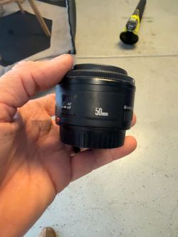 Canon EF 50mm f/1.8 II lens with caps