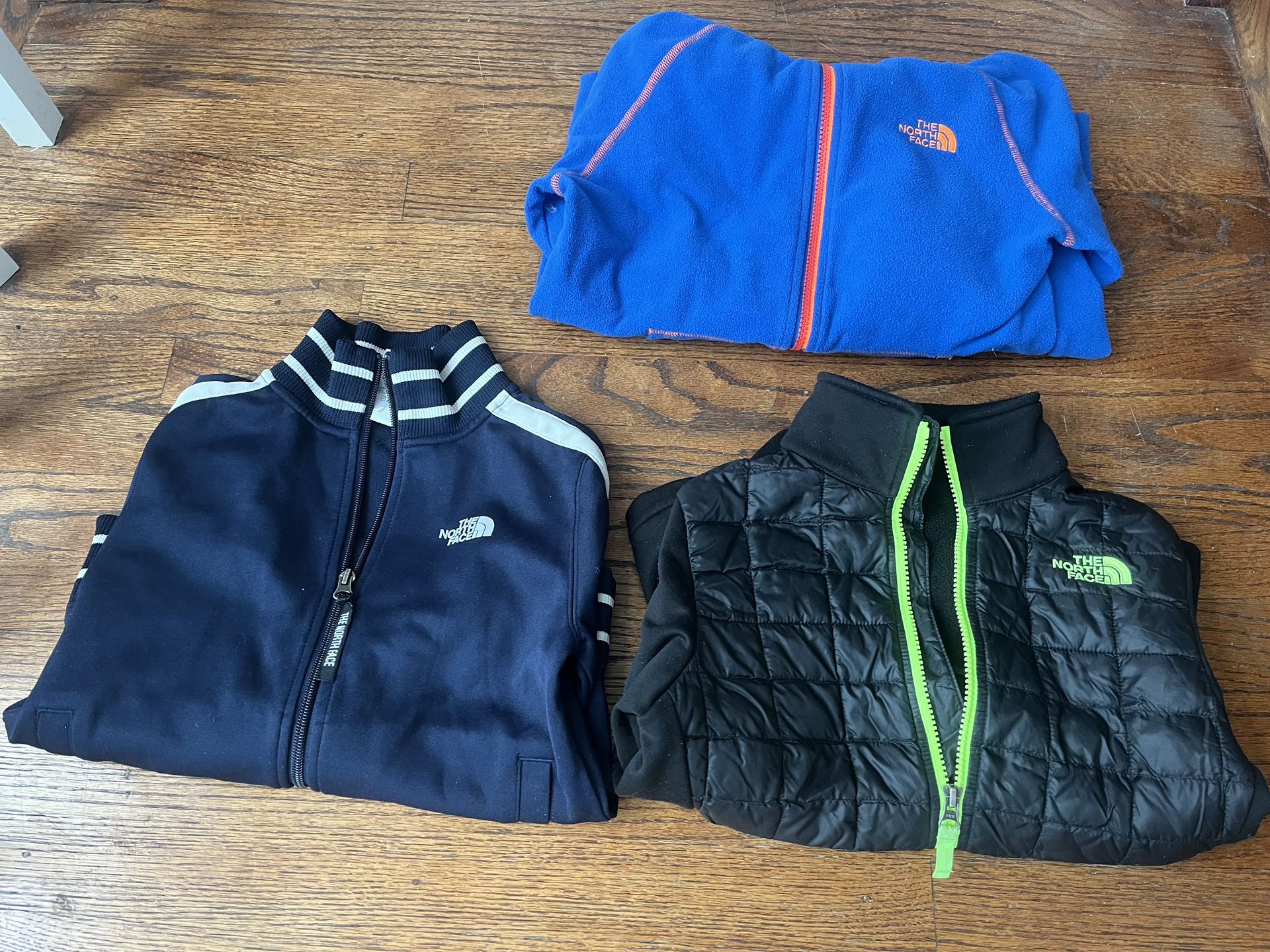 Boys North Face https://offerup.com/redirect/?o=SmFja2V0cy5CbHVlL29yYW5nZQ== Size Lg , Two Others Small 7/8. ($12 For Navy With Striped Collar, $15 Fo