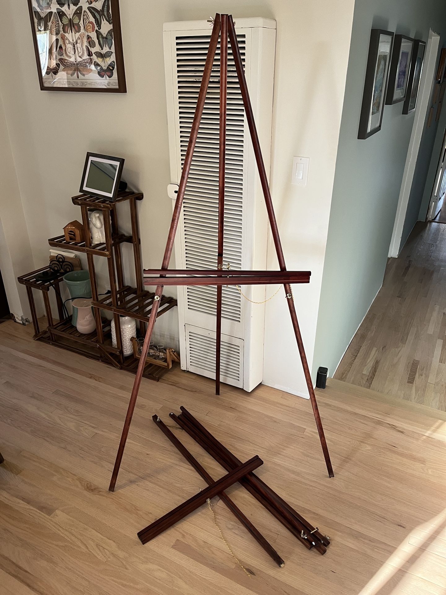 Two large easels, approximately 5’ cherry finish