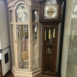 Two Grandfather Clocks. 1 Howard Miller, 1 Ridgeway