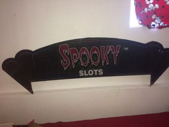 Spooky slots sign above slot machines