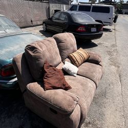 brown reclining loveseat is a dual-sided recliner