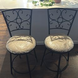 Two counter height swivel stools
