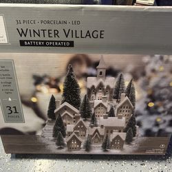 31 piece porcelain Winter Village, Battery Operated!
