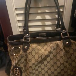 Authentic designer handbag with purchase receipt